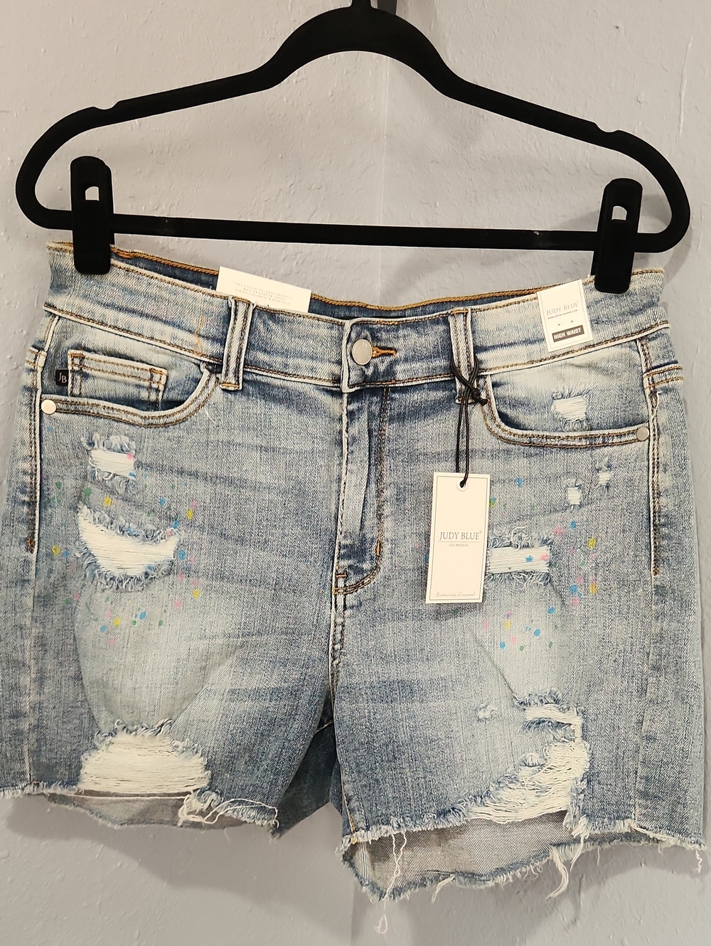 Judy Blue Light Blue Denim with Distressing And Paint Splatter.